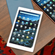 The Amazon Fire HD 10 tablet sitting on a wooden coffee table with other color variants.